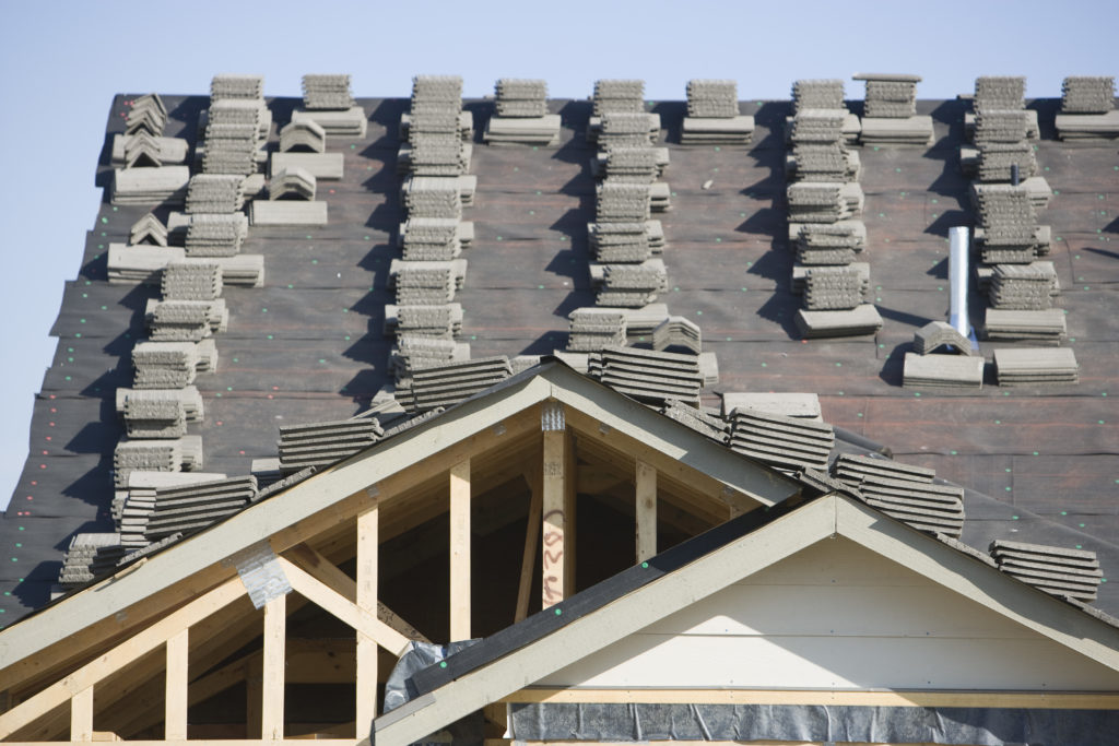 Stacks of tiles on house roof